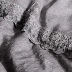 Çanta ruajtëse me mbulesë prej liri me dantella dhe kopsa Sinergia - Energis Viadurini